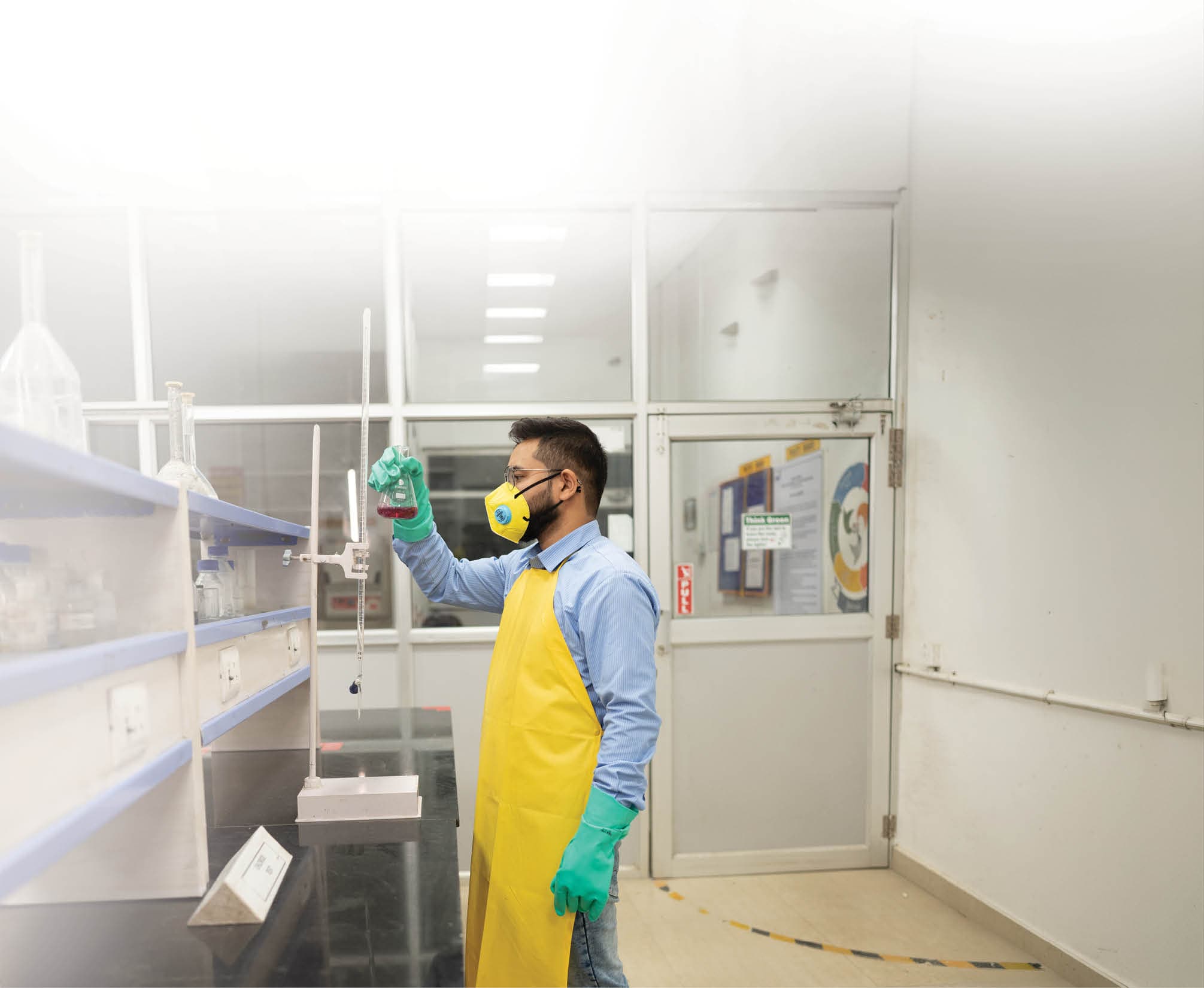 A Dalmia researcher working in a materials laboratory